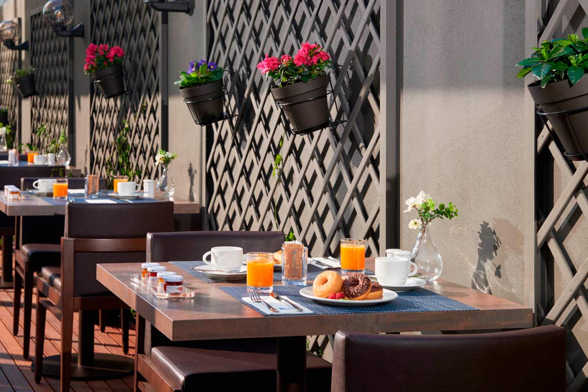  breakfast table with donuts and orange juice 