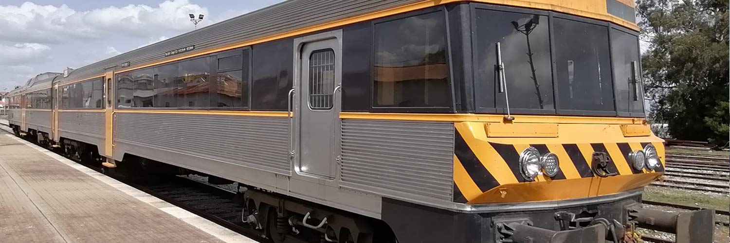 CP 0450 series diesel railcar for Intercidades services and with yellow and gray livery parked on one of the station lines.